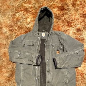 Mens large Carhartt Jacket with hood multiple pockets in and outside the jackets